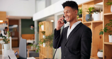 Hotel, reception and booking call of concierge with African man, customer care and hospitality...