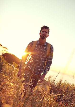 Backpacker, hiking and sunset with mountain, thinking and nature for travel journey and sightseeing....
