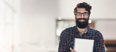 Man, document and smile in portrait at startup with report, admin or project with mock up space in office. Person, writer and happy with paperwork, proposal and contract at creative agency in Italyの写真素材