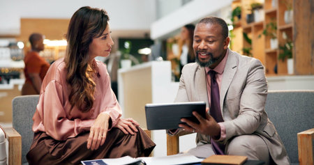 Tablet, hotel lobby and business people with planning, discussion and meeting for conference or...