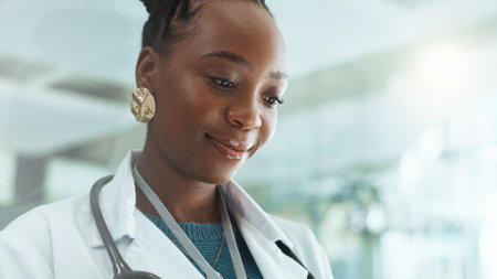 Thinking, doctor and black woman in clinic for healthcare, medical insight or reflection of solution. Idea, hospital and professional surgeon planning future vision, dream and decision for wellnessの写真素材