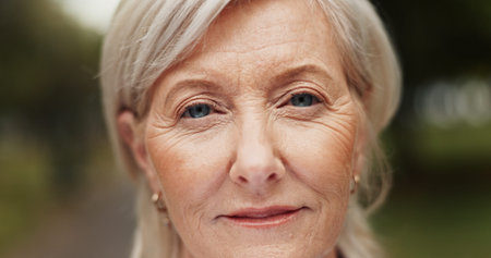 Outdoor, mature woman and portrait with smile for wellness, wrinkles and anti aging with confidence....