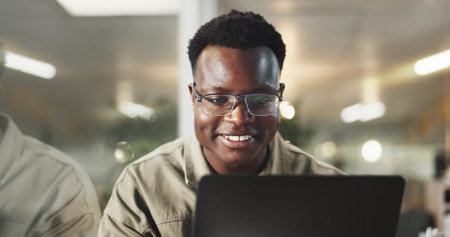 Black man, laptop and global communication in office, email client and online to update website....