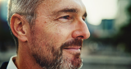 CEO, thinking and businessman in city for vision, insight or profile for inspiration closeup. Face, mature professional and urban planning outdoor for development, future and investment opportunityの写真素材