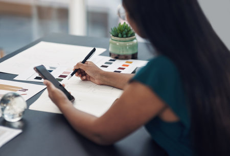 Drawing, designer and phone with woman for fashion ideas, drafting sketch and design of clothes style. Person, mobile and notebook with creative research, inspiration or outfit layout for art processの写真素材