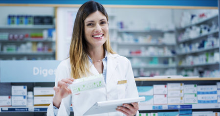 Pharmacist portrait, woman and pills with tablet for inventory check, online order or drugs dispensary. Medical, professional or medication treatment in pharmacy store for pharmaceutical cure packageの写真素材