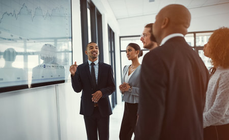 Discussion, TV screen and business people in office with finance statistics for revenue or capital gain. Meeting, data and team of financial consultants with profit growth investment in company.の写真素材