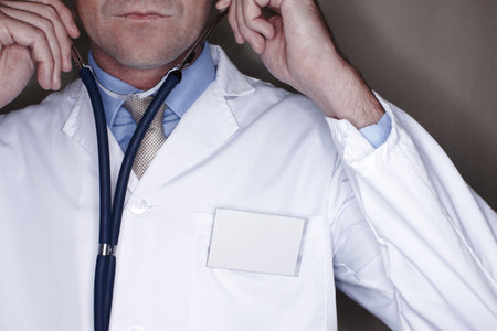 Doctor, stethoscope and hearing for cardiology, hands and healthcare consulting at hospital....