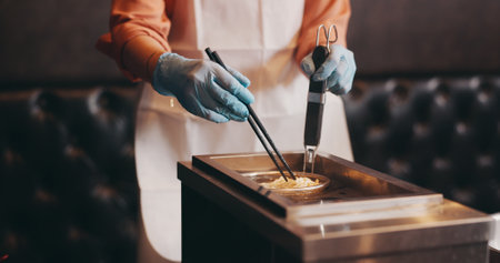 Japan, restaurant cooking and hands boiling noodles for traditional cuisine, culinary culture and meal preparation. Chef, gloves and person steaming ramen in strainer for nutrition and healthy dinnerの写真素材