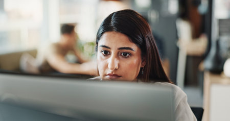 Online, research and computer with business woman in office for planning, networking and company newsletter. Website designer, client feedback and reading with person in creative startup for proposalの写真素材