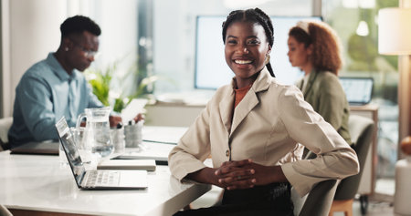 Meeting, portrait and happy woman in office with laptop for research, data analysis or business report. Computer, confidence and businesswoman in boardroom planning online schedule at digital agencyの写真素材