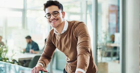Portrait, lawyer and career man with confidence in office as professional, advisor and law firm. Male person, happiness and smile as staff, legal representative and consultant in company or corporateの写真素材