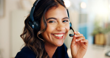 Telecom, agent or portrait of happy woman in call center for consulting, solution or loan help. Headset, face or Indian virtual assistant talking for telemarketing sales or online advice in Indiaの写真素材