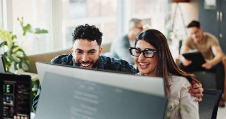 Business people, happy and computer with success, achievement and good news in office. Collaboration, internet and promotion with excited staff, professional and web design with smile and job bonusの写真素材