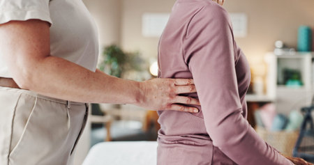 Physiotherapy, consulting and healthcare with old woman and back pain for helping, medical and...