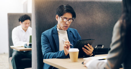 Business, client and man in cafe, tablet and internet with connection, service and network. Japanese people, employees and entrepreneur in restaurant, communication and website info with digital appの写真素材