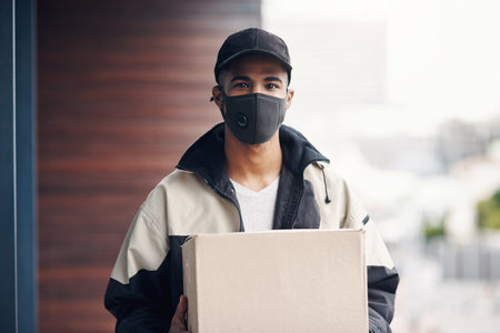 Delivery, face mask and portrait of man with box for online shopping order, courier service and shipping. Ecommerce, supply chain and person outdoors for package, parcel and cargo distributionの写真素材