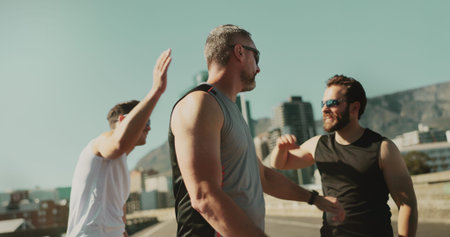 Men, fitness and friends celebrate in city for race, running challenge and marathon training. High...
