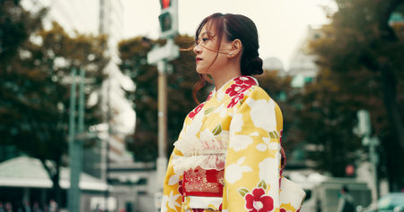 Explore, street and woman in city with kimono, morning commute and sightseeing in traditional clothes. Walking, discover and girl with Japanese fashion, culture or weekend travel on urban adventureの写真素材