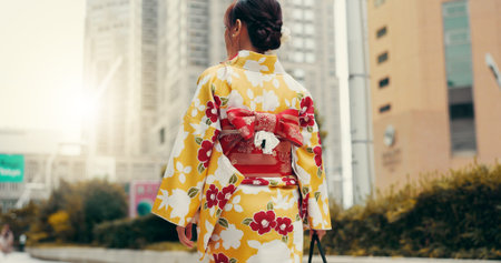 Street, travel and woman in city with kimono, morning commute and sightseeing in traditional clothes...