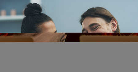 Home, funny and couple on couch, tablet and online humor with connection, love and laughing in lounge Apartment, joy or man with woman on sofa, tech or meme with happiness, relax and bonding togetherの写真素材