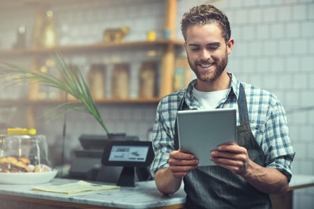 Tablet, man and portrait of barista in coffee shop for online menu update or stock control. Serving...