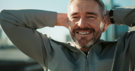 Mature man, fitness and smile with break for race, running challenge and marathon training. Portrait, exhausted and male athlete sweating with cardio exercise or workout in urban city with fatigueの写真素材