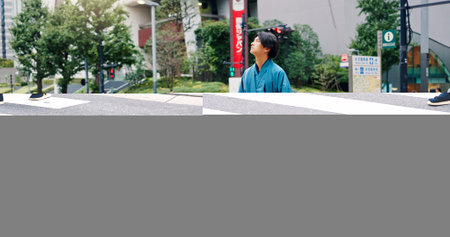 Kimono, crosswalk and travel with Japanese man in city for ceremony, heritage and pride. Respect, urban and indigenous with person in japan street for traditional clothes, Buddhism and festivalの写真素材