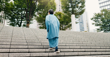 Japanese man, back and steps with traditional clothes, outfit and yukata for heritage. Guy, holiday...