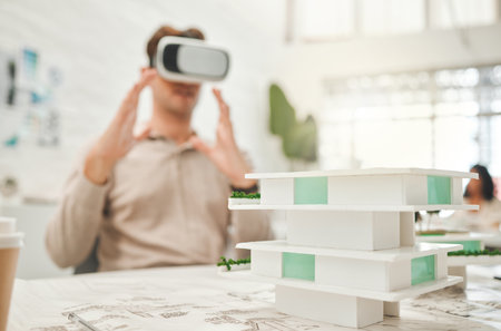 Man, architecture and vr headset in office with building design, architect game and ai construction. Male person, 3D simulation and planning for property development, review renovation and innovationの写真素材