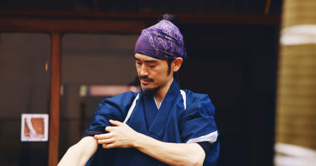 Japanese, man and sensei ready for fight with martial arts preparation, fitness training and culture challenge. Master, karate and exercise of taekwondo battle, workout practice and creative in Japanの写真素材