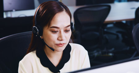 Business, call centre and woman in office, telemarketing and customer service with headset. Japanese...