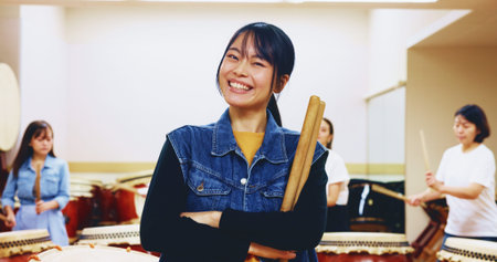 Portrait, Japanese woman and drum sticks for teaching music, community practice and art performance....