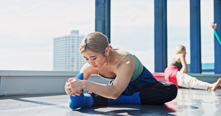 Dancer, fitness and woman stretching legs for body health, start or prepare for performance in...