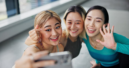 Selfie, friends and happy for fitness, influencer and picture in yoga class, break and memory for women. Healthy, personal trainer and photography for moment, people and smile for workout and Japanの写真素材