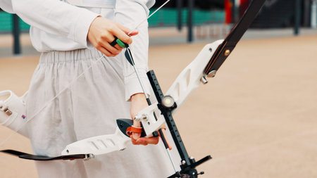 Hands, archer and bow for training, skills and preparing for competition, equipment and outdoor for...