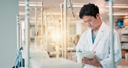 Clipboard, checklist and medical research with man in laboratory for science study or future innovation. Healthcare, vaccine report and test with Japanese person for inventory, notes and resultsの写真素材