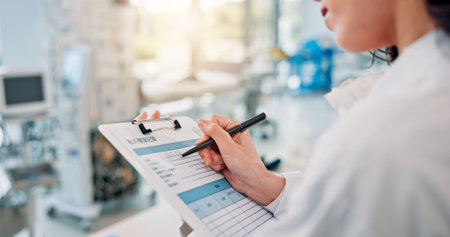 Clipboard, checklist and writing with woman in laboratory for medical, science study or future research. Healthcare, vaccine report and test with Japanese person for inventory, notes and resultsの写真素材