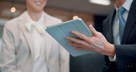 Office, tablet and hands of business people in meeting for research project, online report and website. Professional, Japan company and workers on digital tech for planning, networking and discussionの写真素材