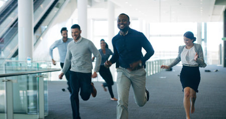 Running, race and competition with business people in office for candidate success, hiring or promotion. Professional rivals, deadline or opportunity with group of employees in agency for recruitmentの写真素材