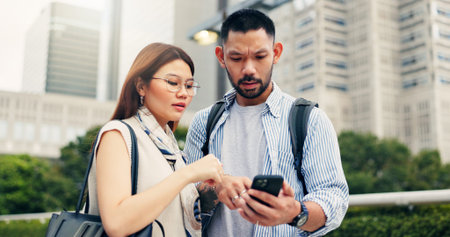 Couple, phone and travel with direction in city, click and mobile app for location, landmark and...