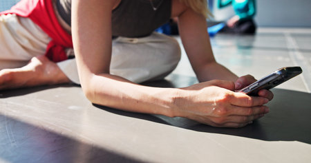 Phone, stretch and dancer typing in studio for networking, communication or contact with app. Hands,...