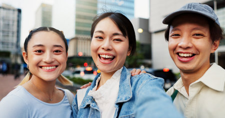 Japanese, people and selfie for portrait in city of photography, social media post and travel abroad. Friends, commute and profile picture update of tourism memory, reunion and bonding in urban Japanの写真素材