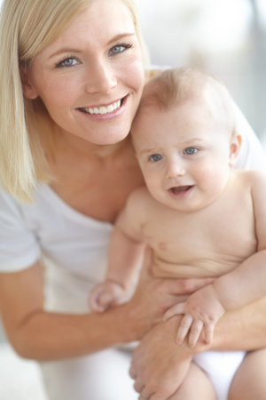 Mom, baby and smile at apartment with bonding for love, care and support with pride for motherhood....