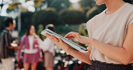 Online, hands and person with tablet outdoor for social networking, reading ebook or travel location...