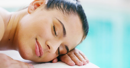 Woman, spa and relax for massage with sleeping for luxury, self care and wellness. Female person, customer and break or resting at resort for body therapy service, treatment and peace as clientの写真素材