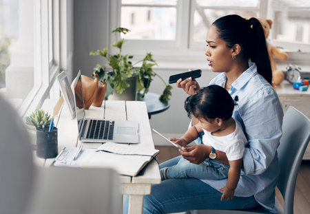 Remote work, child and woman with laptop for phone call, article questions and voice note for publication. Freelancer, girl or mother as journalist for multitasking, mobile speaker or tablet for babyの写真素材