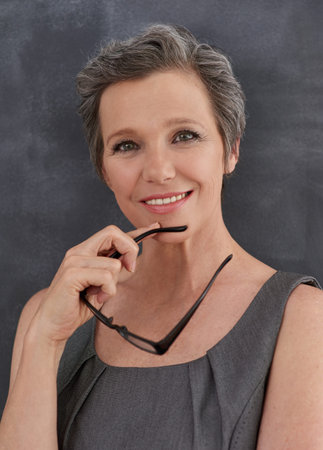 Chalkboard, makeup and portrait of teacher woman in classroom for development, education or lesson....