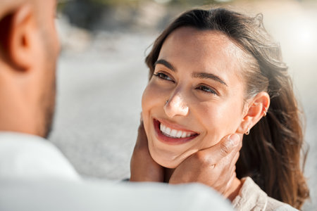 Happy woman, romance or couple hug at sea to travel for love on vacation, valentines day or holiday. Holding, face or people at beach for bonding together for romantic trip on tropical island in Baliの写真素材