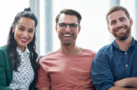 Business people, happy and portrait at job with contact us, smile and web designer team. Joke, laughing and diversity with meeting, funny group and collaboration success for professional projectの写真素材